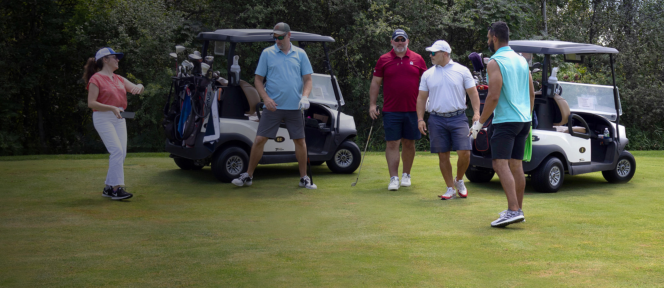a group of golfers on the green